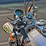 This close-up image of a cruiser motorcycle’s handlebars and gauges highlights the type of vehicle that requires proper motorcycle licensing for legal road use